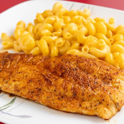 Cajun fish, served with Mac and Cheese.
