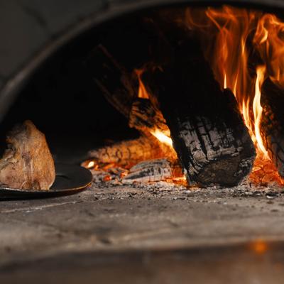 Wood burning in the oven.
