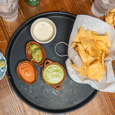 Tortilla chips served with homemade salsa, creamy queso and fresh guacamole.