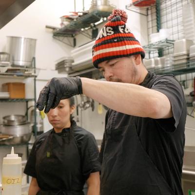 Staff members in the kitchen.