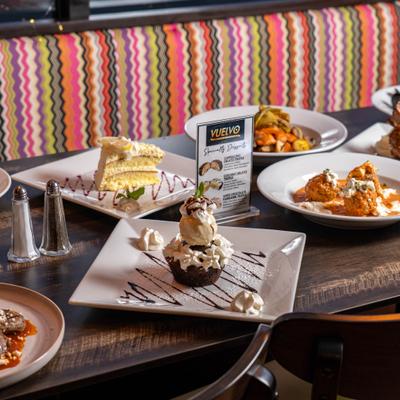 Varuious desserts and main dishes served on the table.