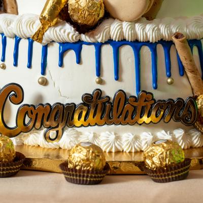 Birthday cake decorated with chocolate balls.