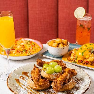 A brunch spread featuring several dishes and drinks..