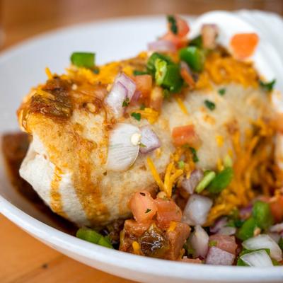 A close up shot of breakfast burrito.