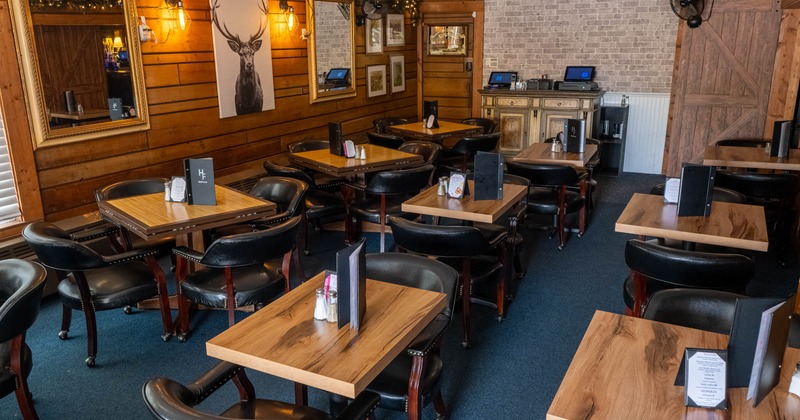 Interior, tables and chairs in dining area