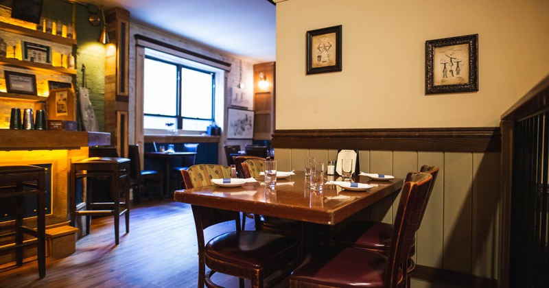 Interior, a set table for dining near a bar