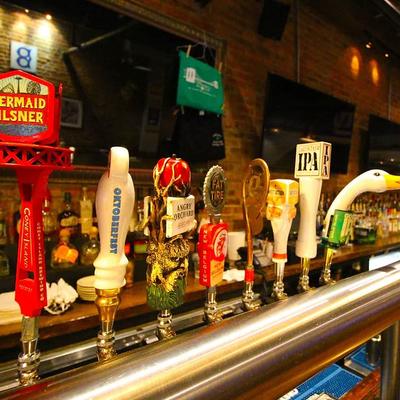 Beer taps with colorful handles.