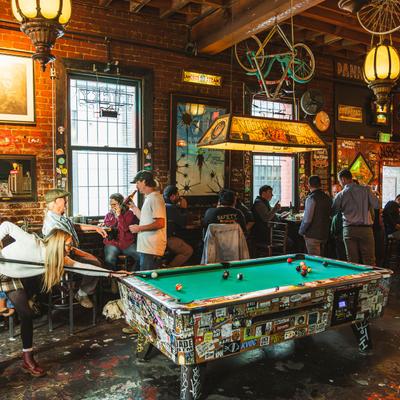 Customers playing pool.