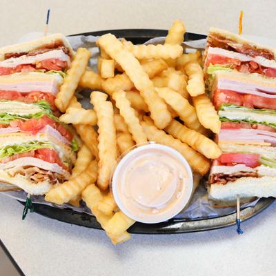 Club Sandwich with fries and sauce dip