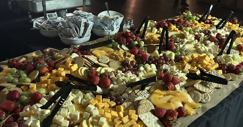 A large, elaborate cheese board or charcuterie spread