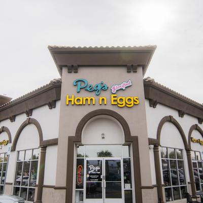 Restaurant exterior with sign and entrance.