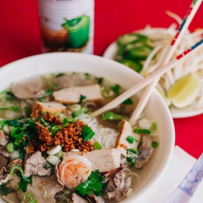 Noodle soup, with shrimp, sliced beef, meatballs, honeycomb beef tripe, meatloaf, and scallions.