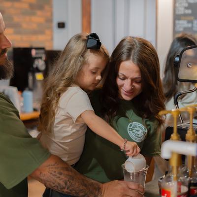 A family of three serving themselves.