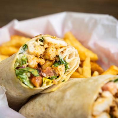 Blacken Heaven wrap served with fries.
