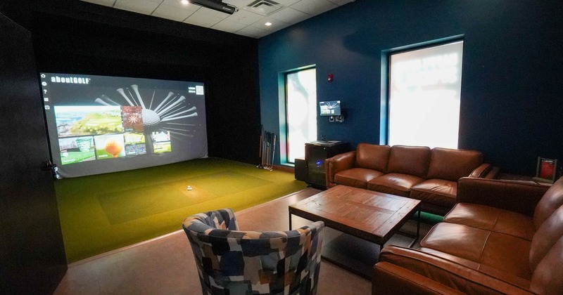 Interior, seating area with indoor golf court