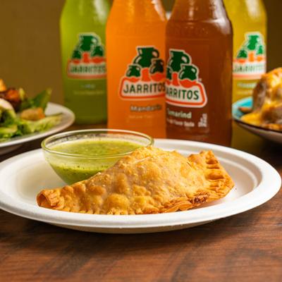 Empanada with dip, and Jarritos soda.