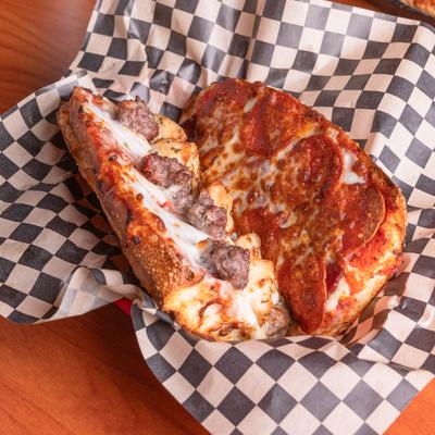 Sub sandwich with pepperoni, salami, sausage, beef and mozzarella cheese.