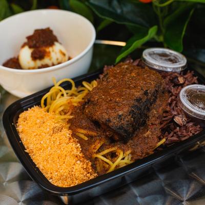 Grilled meat with rice, vegetables on the side