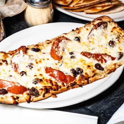 Greek flatbread with feta, tomato, kalamata olives and three cheese blend.