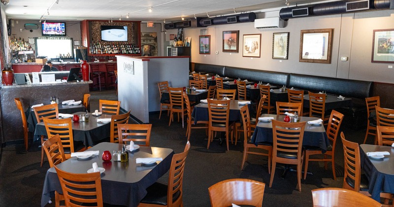 Interior, wide view, dining area, tables and chairs ready for guests