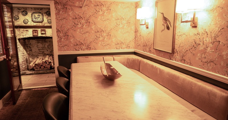 Interior, tables, benches, brick walls, windows, lighting, plants