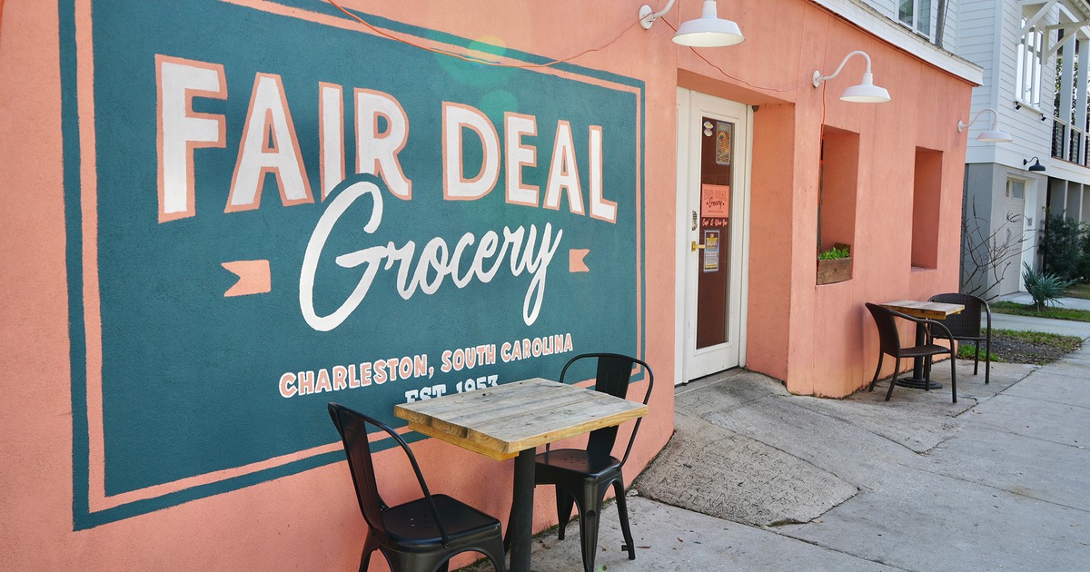 Outdoor seating area, two tables for two guests in front of the entrance
