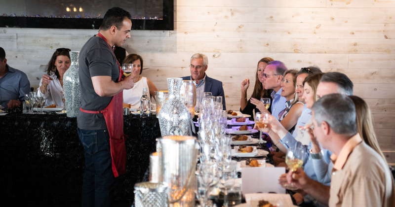 Staff member taking orders from customers