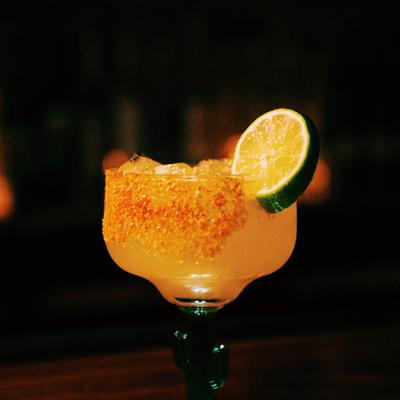 A cocktail decorated with a lime wedge