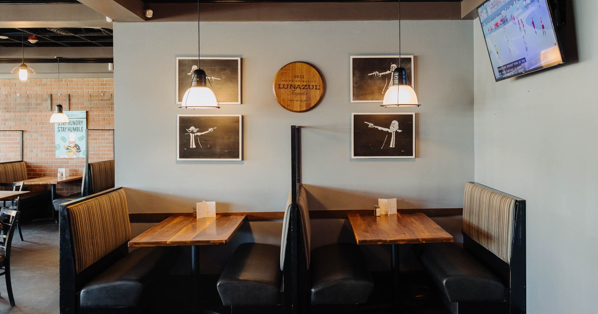 Interior, booth area, framed pictures on the wall