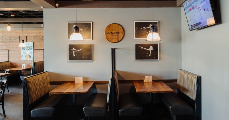 Interior, booth area, framed pictures on the wall