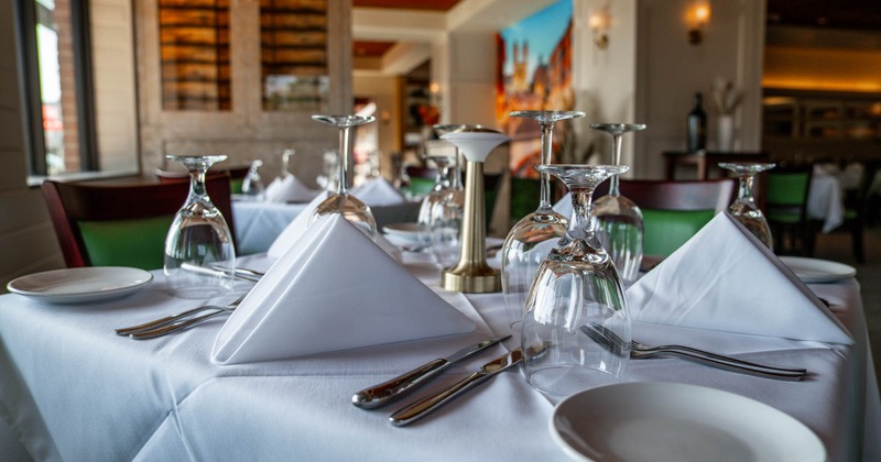 Interior, table with plates and glasses, closeup