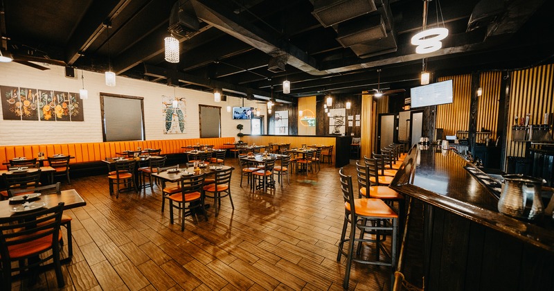 Interior, dining area with set tables and bar