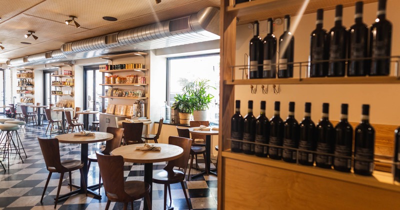 Interior, seating area, wine rack, shelves with merchandise items