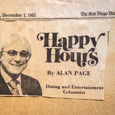 An old newspaper clipping featuring a column title and a headshot of the columnist