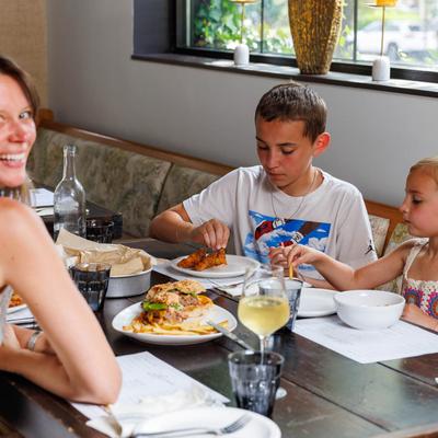 A group of guests enjoy a meal at the restaurant.