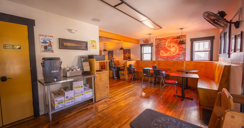 Interior, tables, chairs and wooden sitting booths