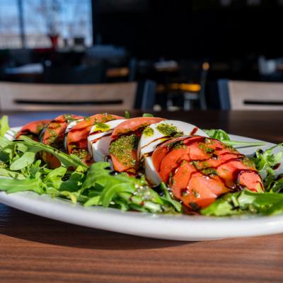 Caprese Garden Salad on a bed of arugula.