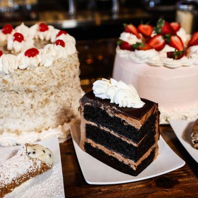 whole round cakes and cake slices.