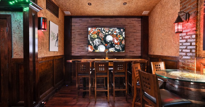 Large tavle in our back room in front of lit artwork