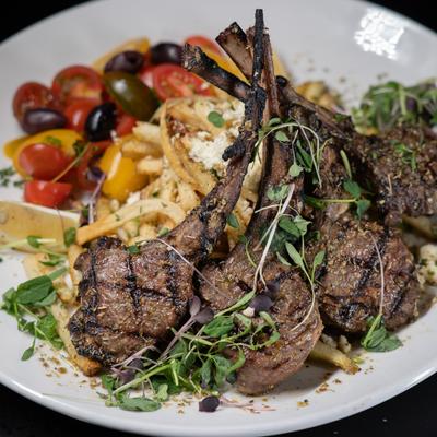 Grecian Lamb Chops with Greek fries and dressed cherry tomatoes.