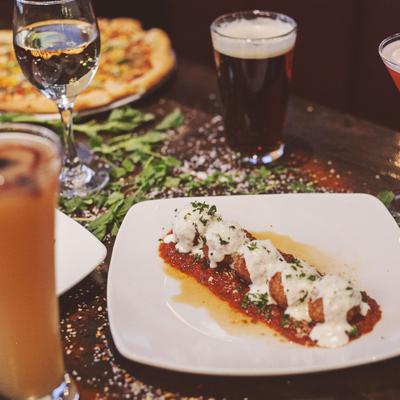 Fried arancini balls, served with pomodoro and fontina cream sauce