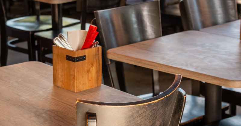 Diner table, chairs, Cutlery rack on a table