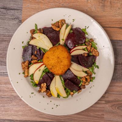 Beet and apple salad with walnuts, overhead view.