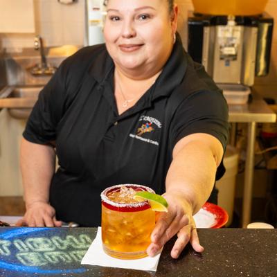 A staff member serving a drink.