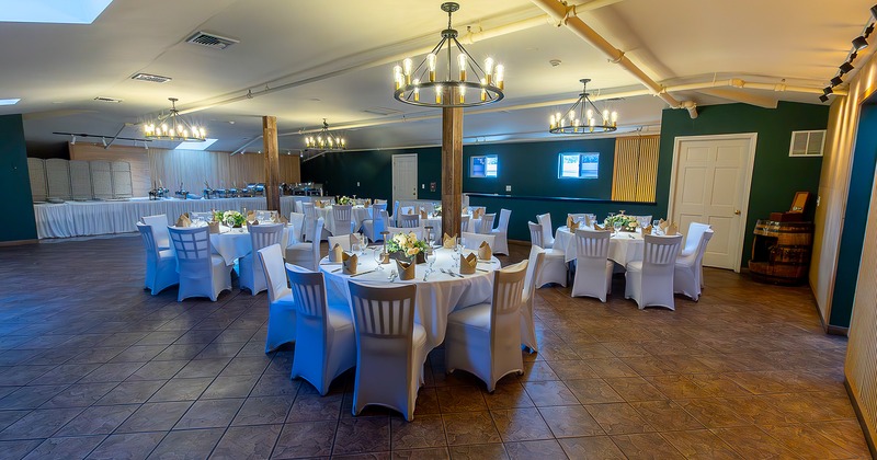 Nicely done event space room with set tables, perfect for all types of events