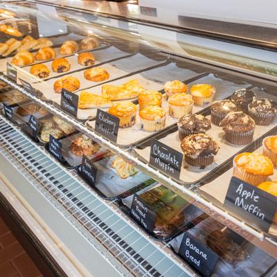Bakery display case with assorted baked goods.