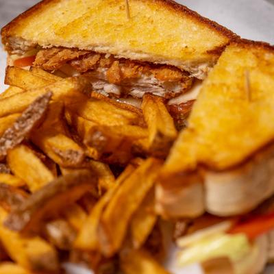 Chicken sandwich with fries.