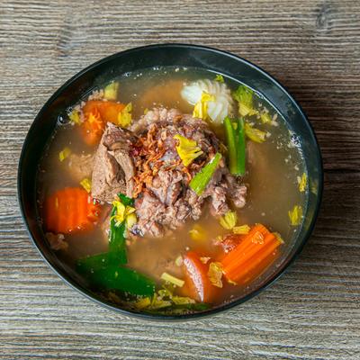 Oxtail Soup with vegetables, top view.