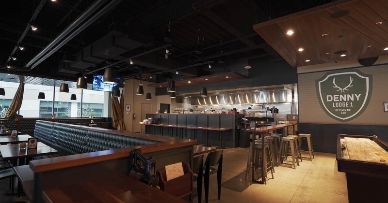 Interior, booth seating area on the left, bar stools and table on the right