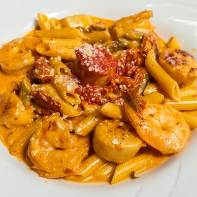 Shrimp and scallops with penne pasta and creamy vodka sauce.